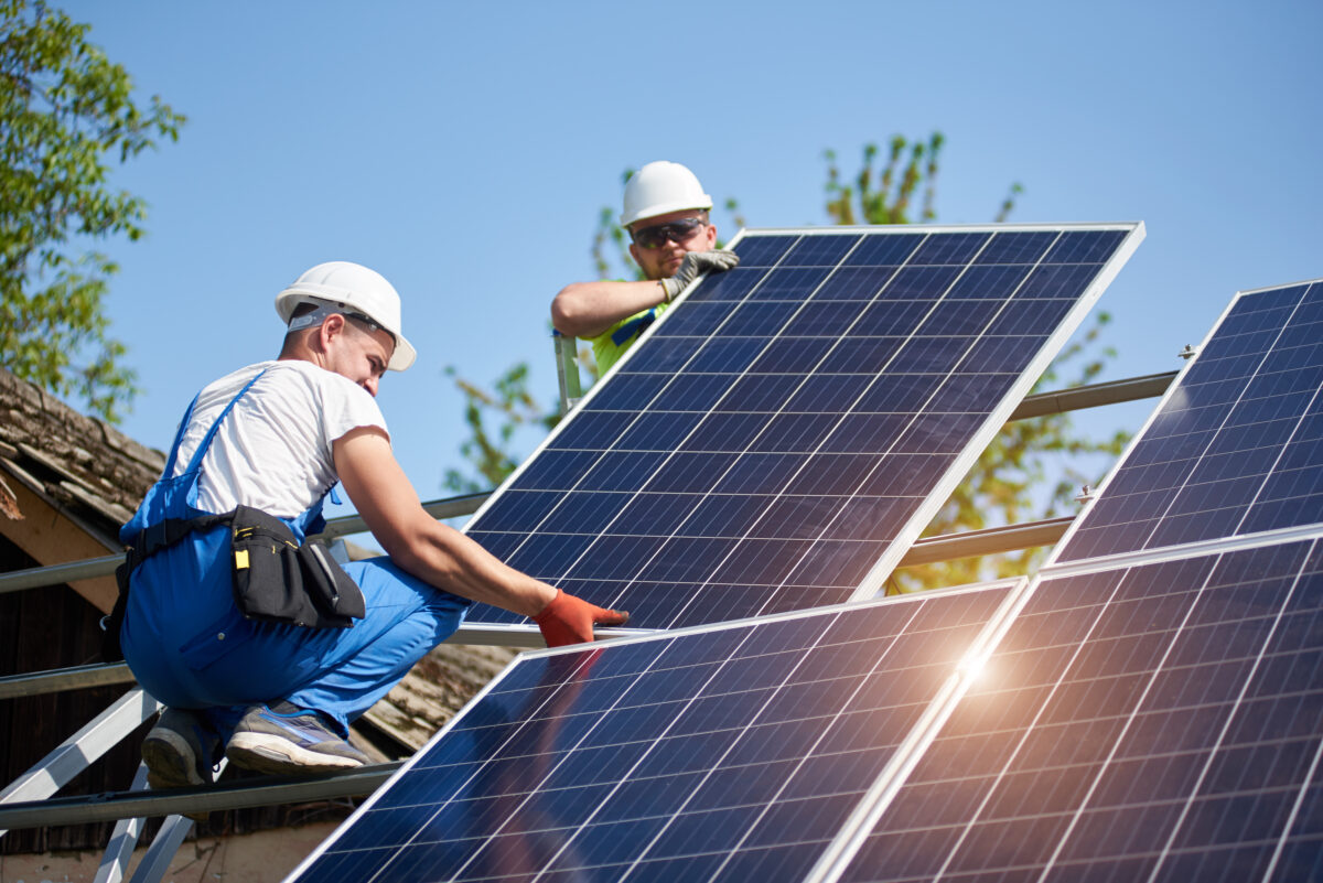 Stand-alone exterior solar panel system installation, renewable green energy generation concept.